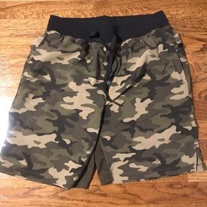 Mens size Medium Fabletics workout shorts with boxer brief liners.